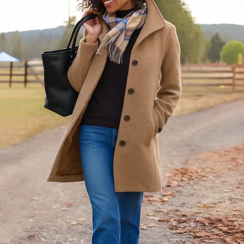 Women's long button-front coat with shirt collar, long sleeves and side pockets