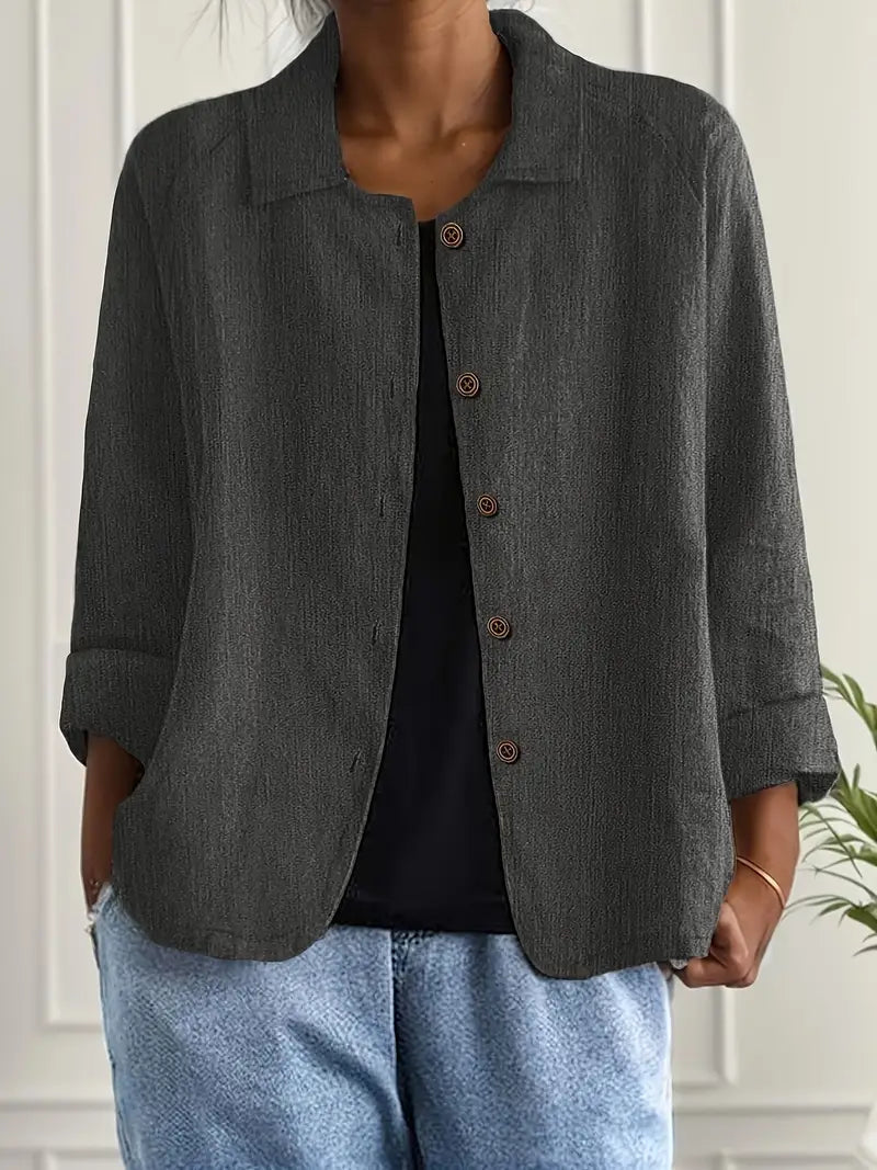 Women's button front collared jacket with long sleeves and rounded hem