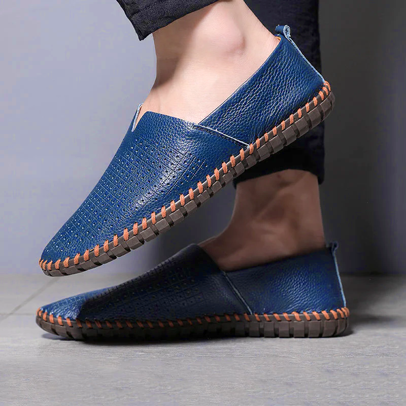 Men's textured slip-on loafer with contrasting stitched trim and flat treaded sole