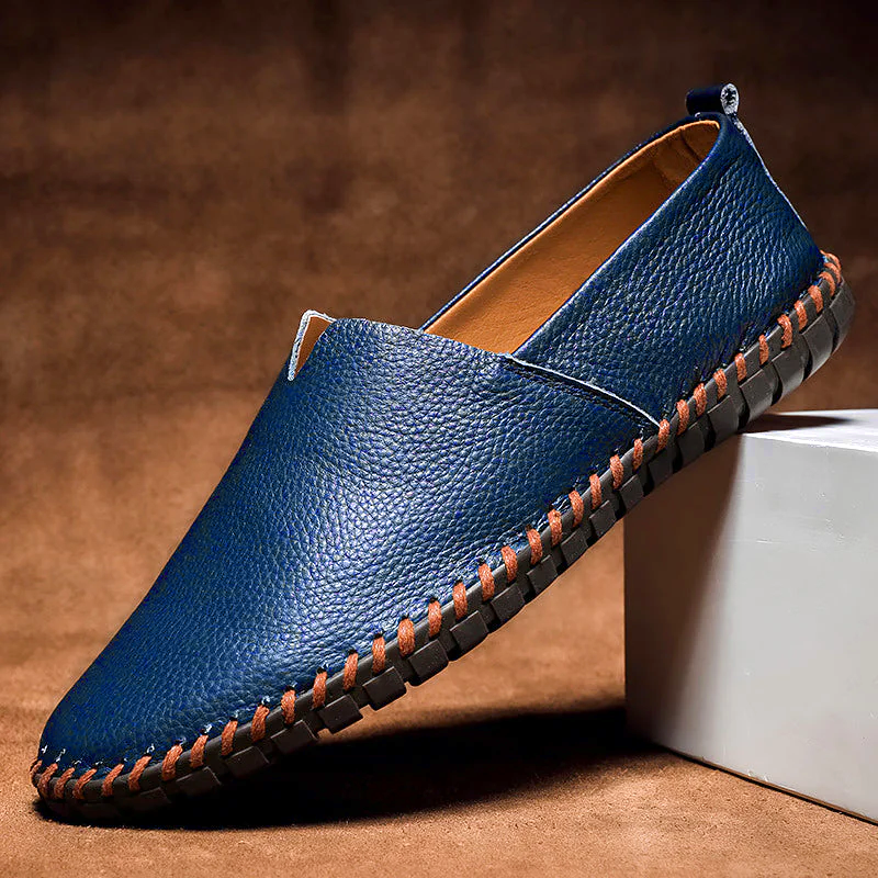Men's textured slip-on loafer with contrasting stitched trim and flat treaded sole