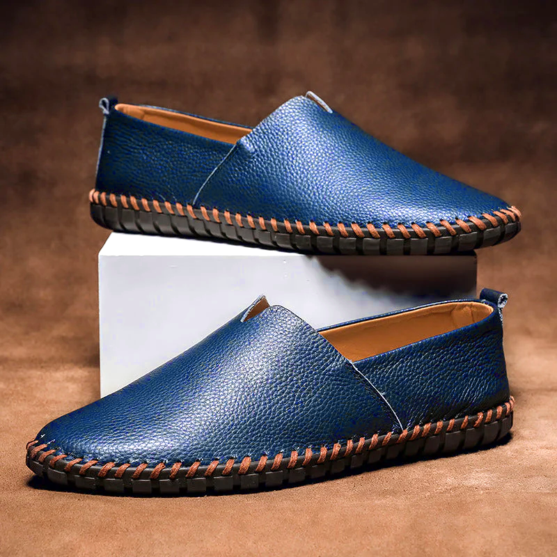 Men's textured slip-on loafer with contrasting stitched trim and flat treaded sole