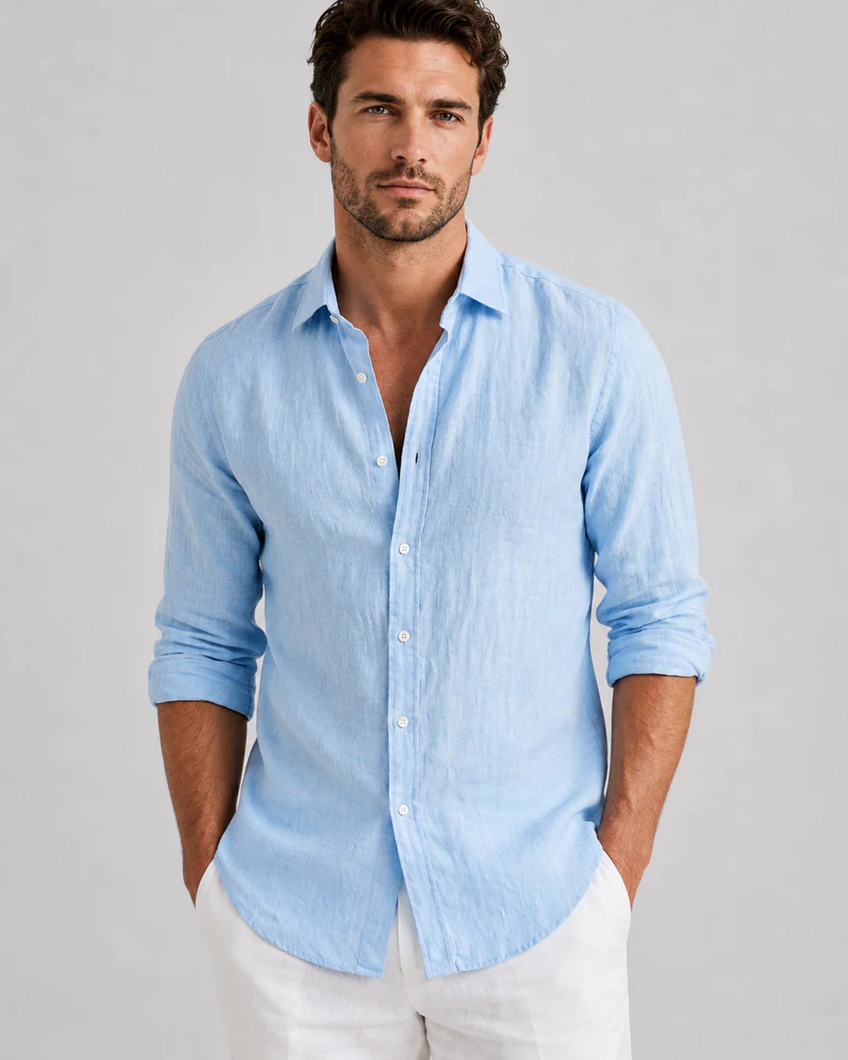 Men's long-sleeve textured button-up shirt with spread collar and curved hem
