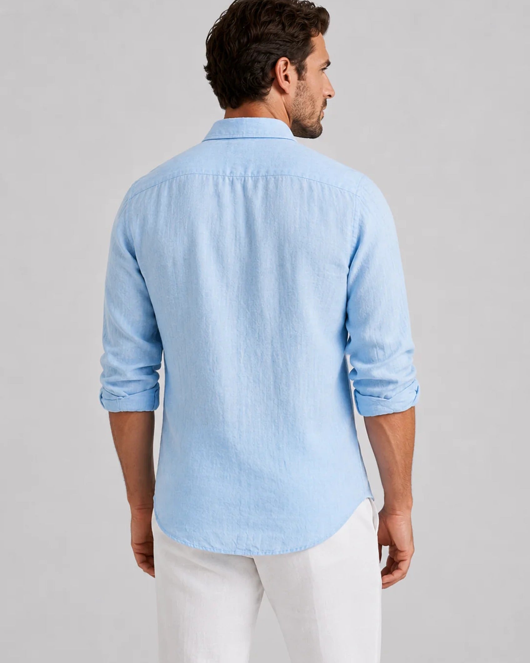 Men's long-sleeve textured button-up shirt with spread collar and curved hem
