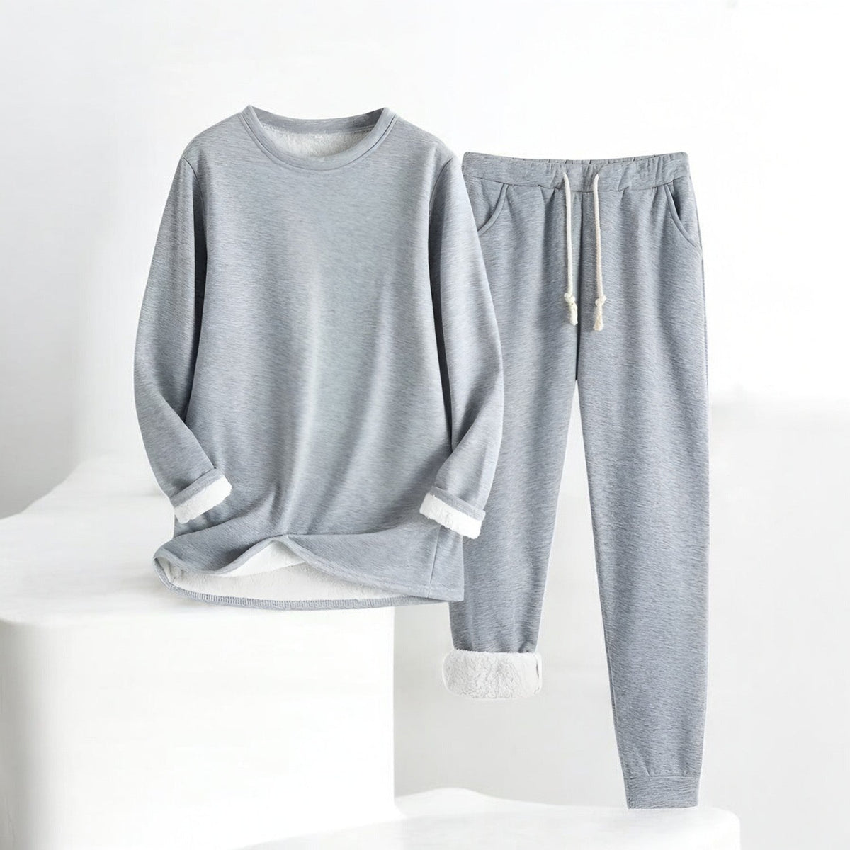 Two-piece crew neck sweatshirt and jogger set with contrasting white cuffs and drawstring trousers