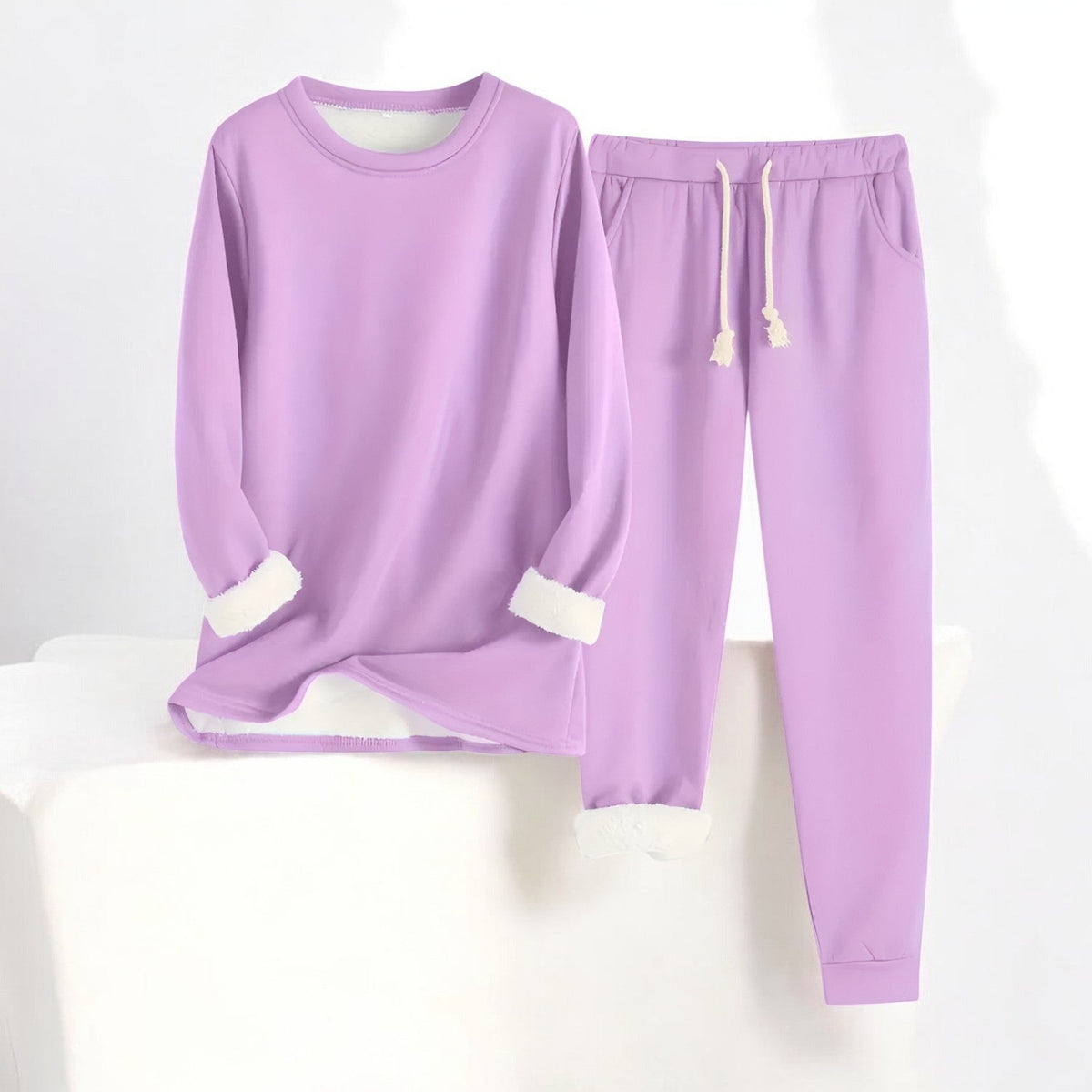 Two-piece crew neck sweatshirt and jogger set with contrasting white cuffs and drawstring trousers