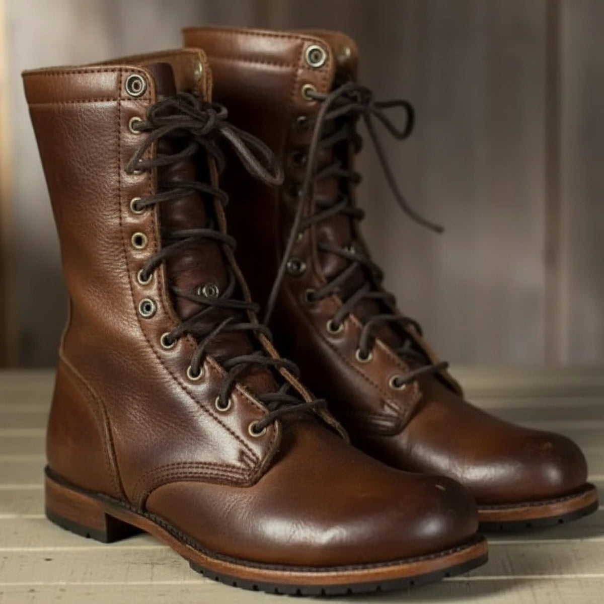 Men's high ankle lace-up boots with round toes, low heels and treaded soles