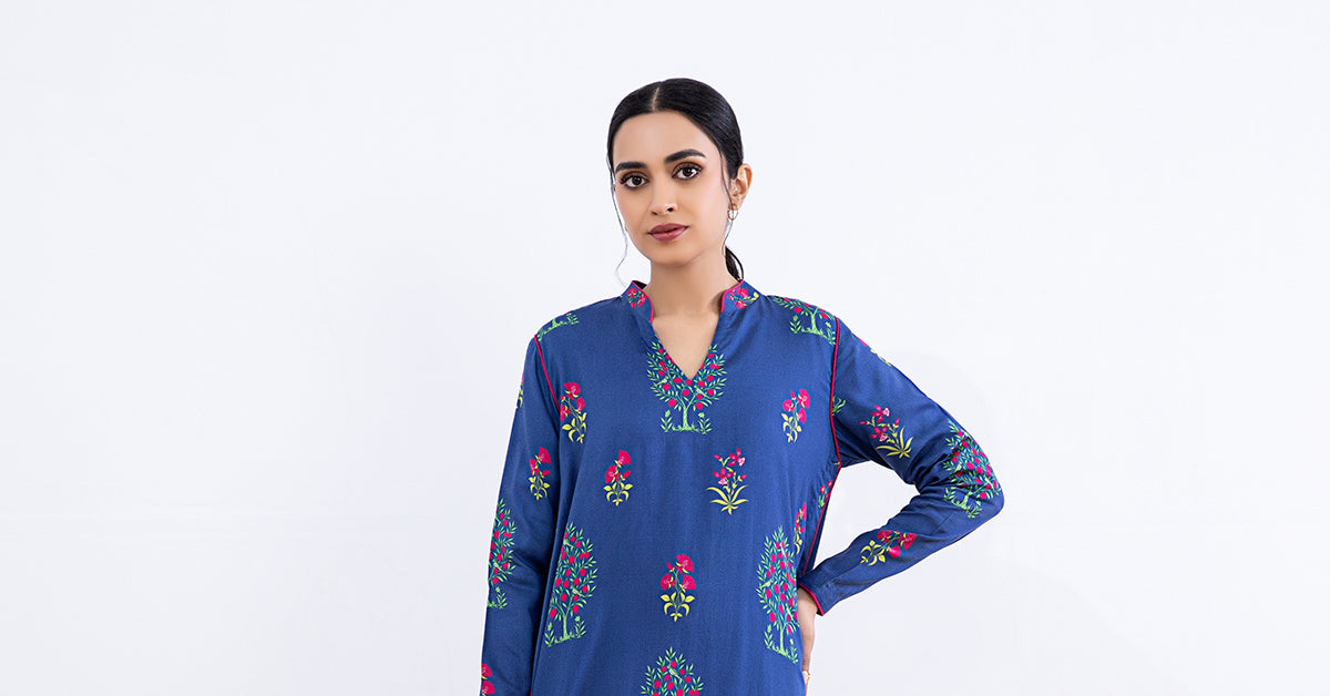 Women's blue floral two-piece suit with long tunic and matching trousers