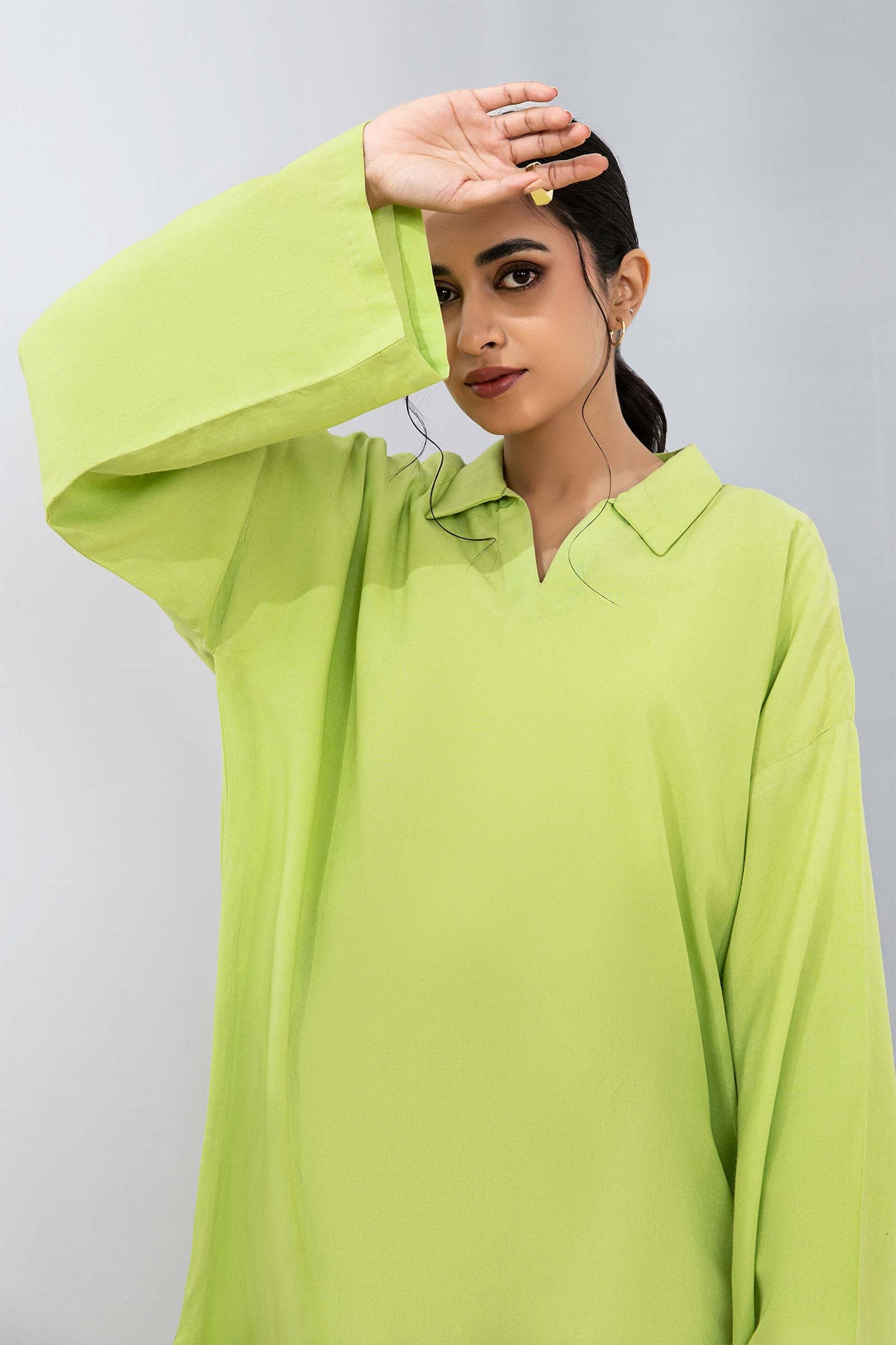 Women's lime green collared tunic with geometric cropped trousers