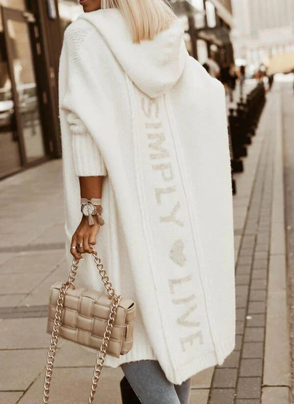 Women's longline hooded knitted cardigan with graphic text on the back