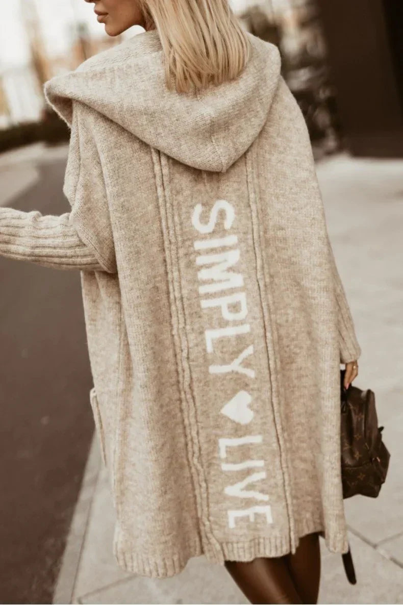 Women's longline hooded knitted cardigan with graphic text on the back