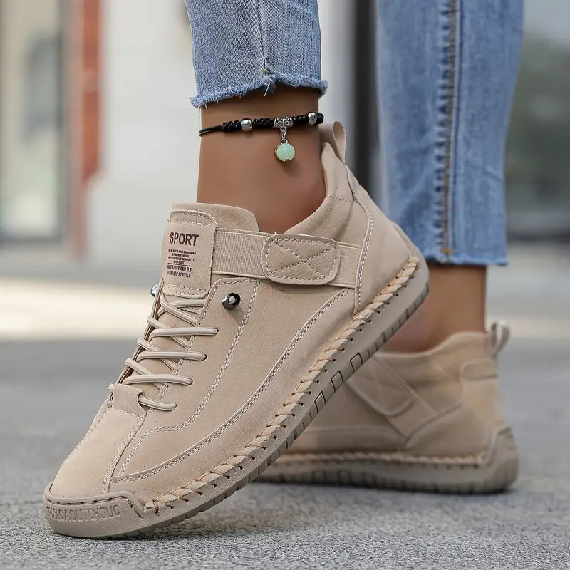 High-top lace-up trainers with ankle strap and flat treaded sole