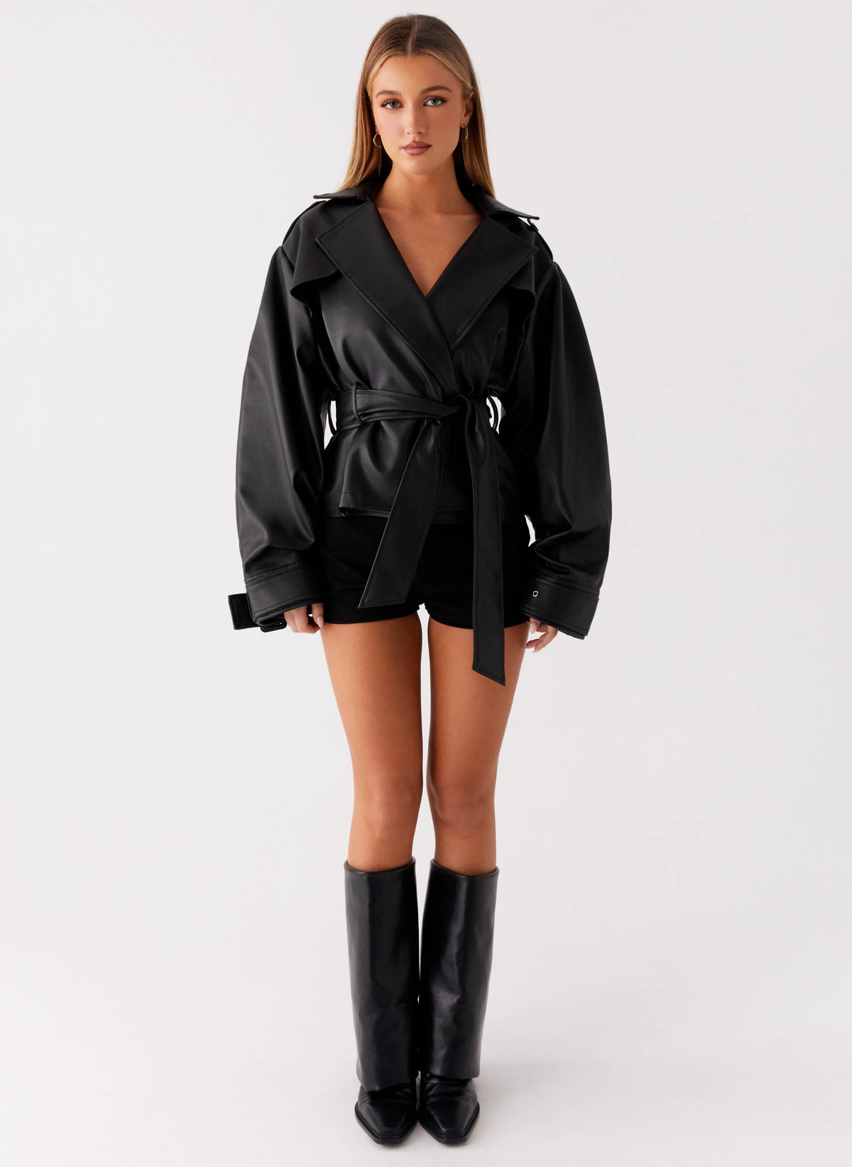 Women's black belted trench jacket with wide lapels and long sleeves