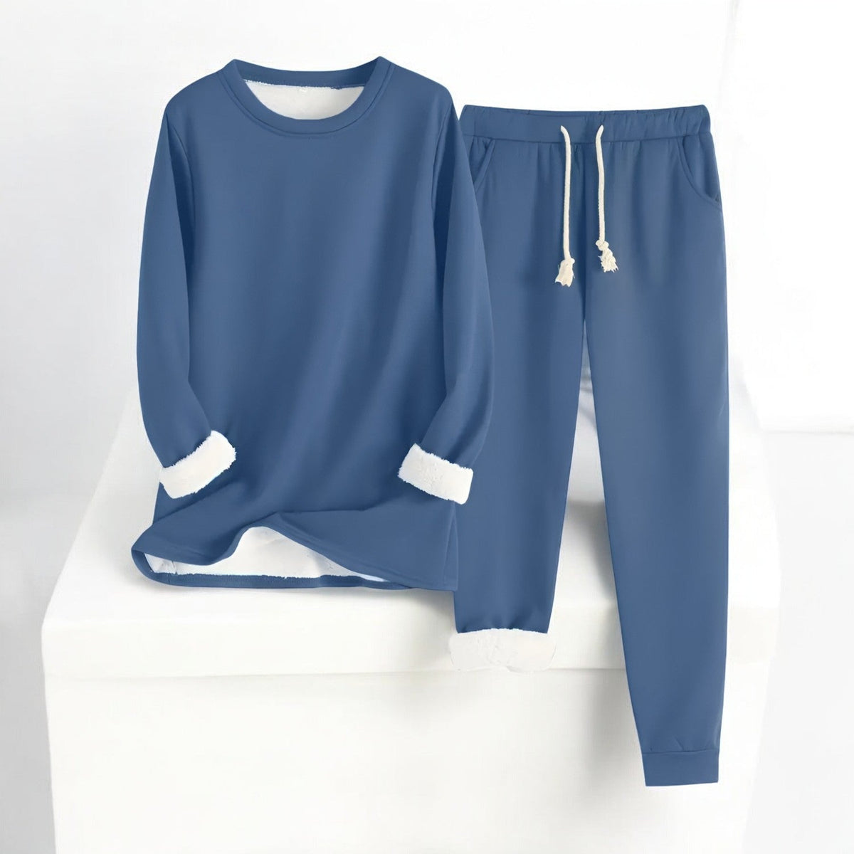 Two-piece crew neck sweatshirt and jogger set with contrasting white cuffs and drawstring trousers