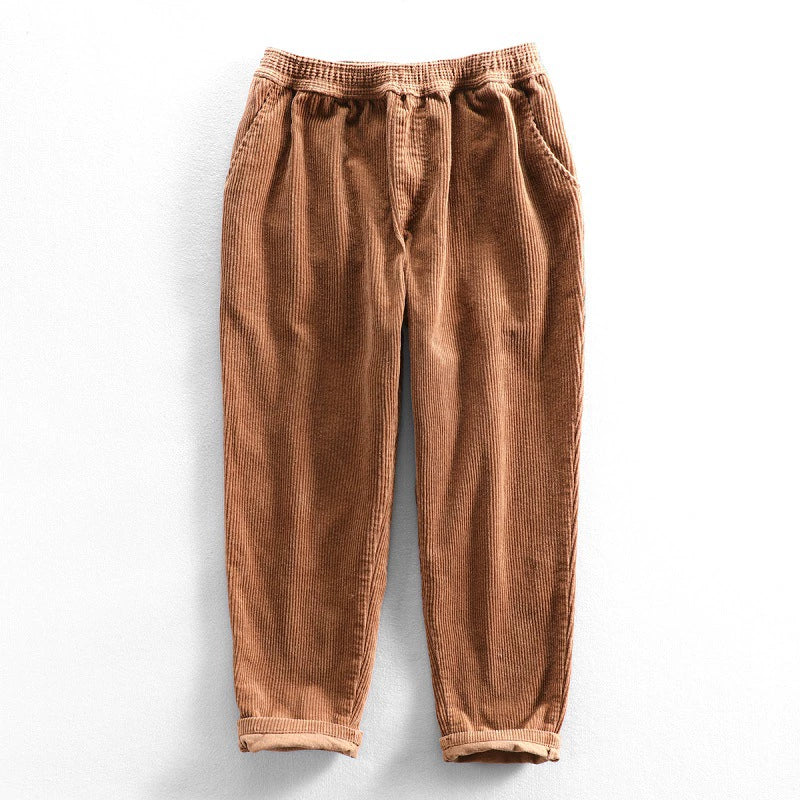 Men's tapered corduroy trousers with elasticated waist and turned-up cuffs
