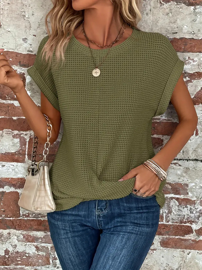 Women's short-sleeve waffle-knit top with a crew neckline and front pocket