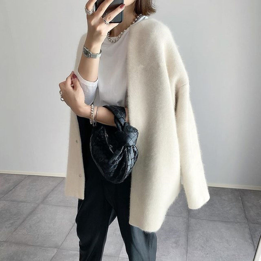 Women's longline button-front cardigan with round neckline and long sleeves