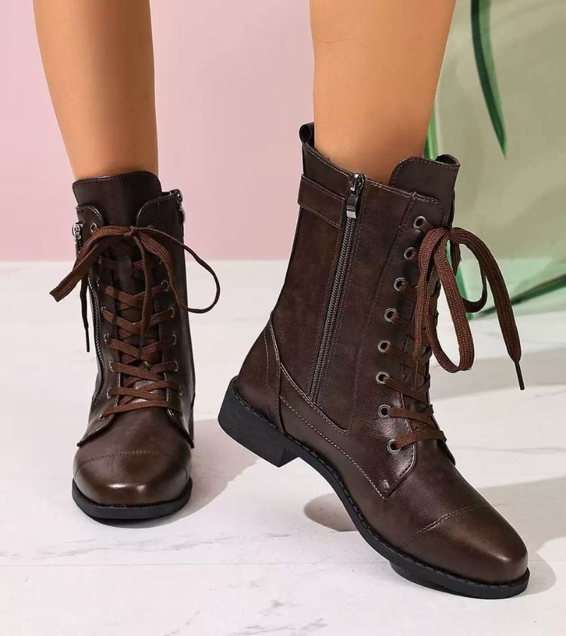 Women's mid-height combat boots with laces, side zip and buckle detail