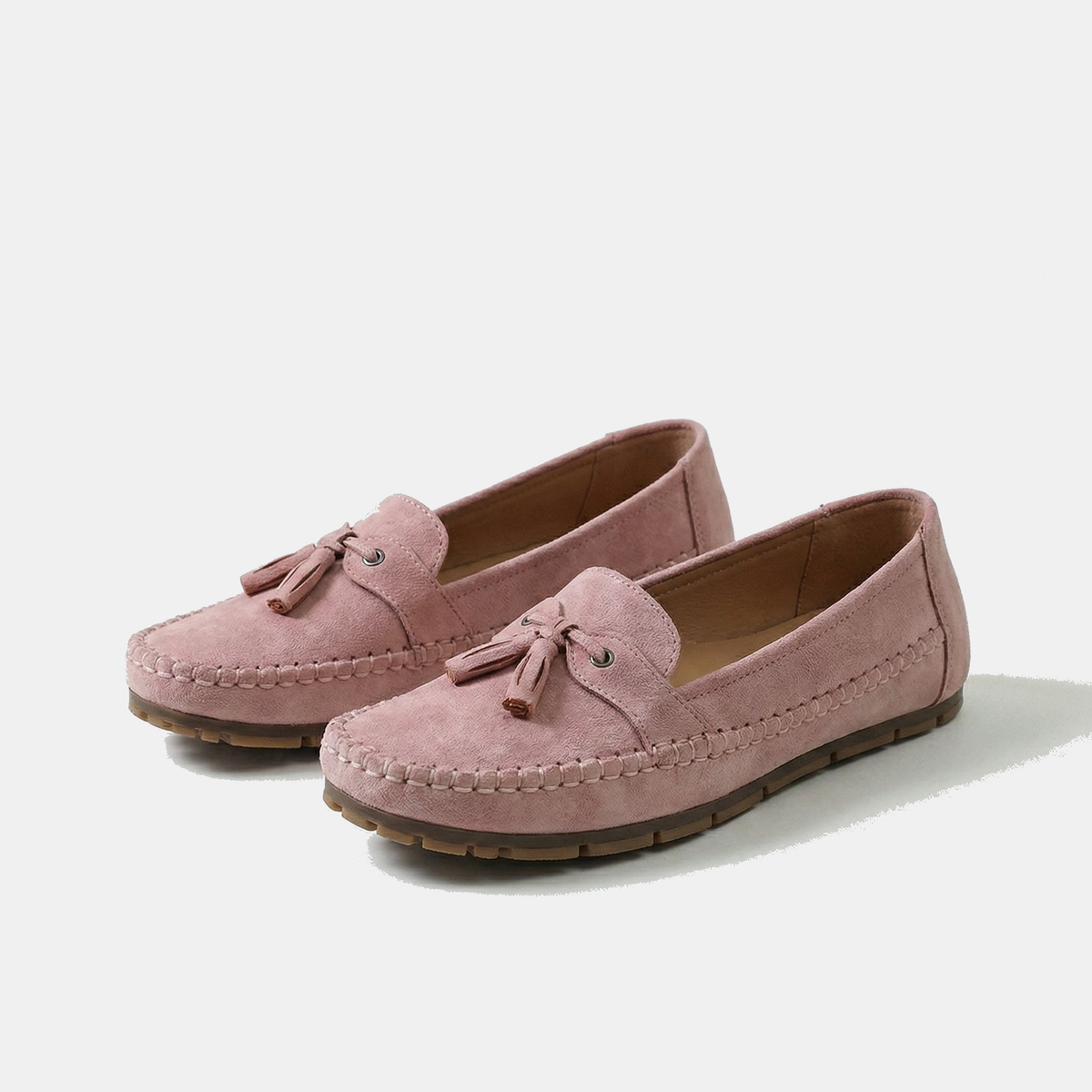Women's flat loafers with front tassels, decorative lacing and stitched edging