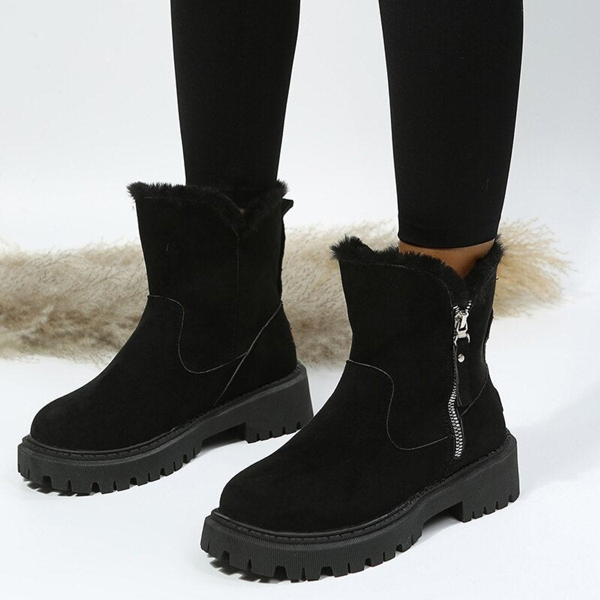 Women's fur-lined ankle boots with side zips and chunky lug soles