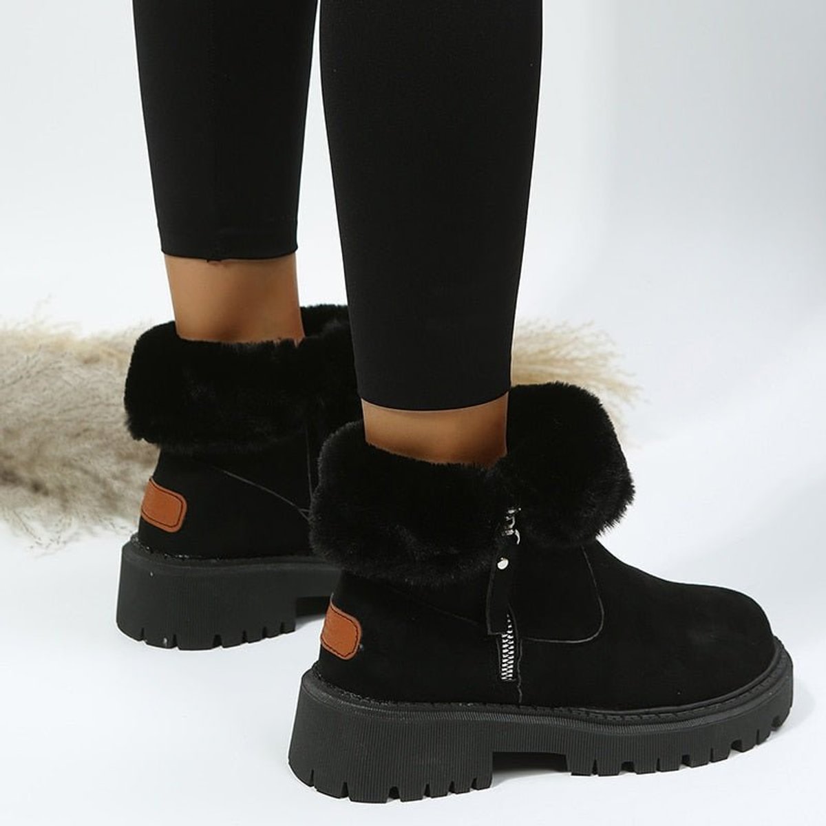 Women's fur-lined ankle boots with side zips and chunky lug soles
