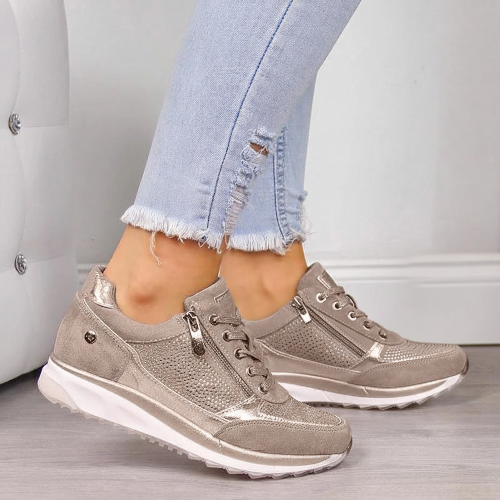Women's low-top lace-up sneakers with metallic panel details and raised soles