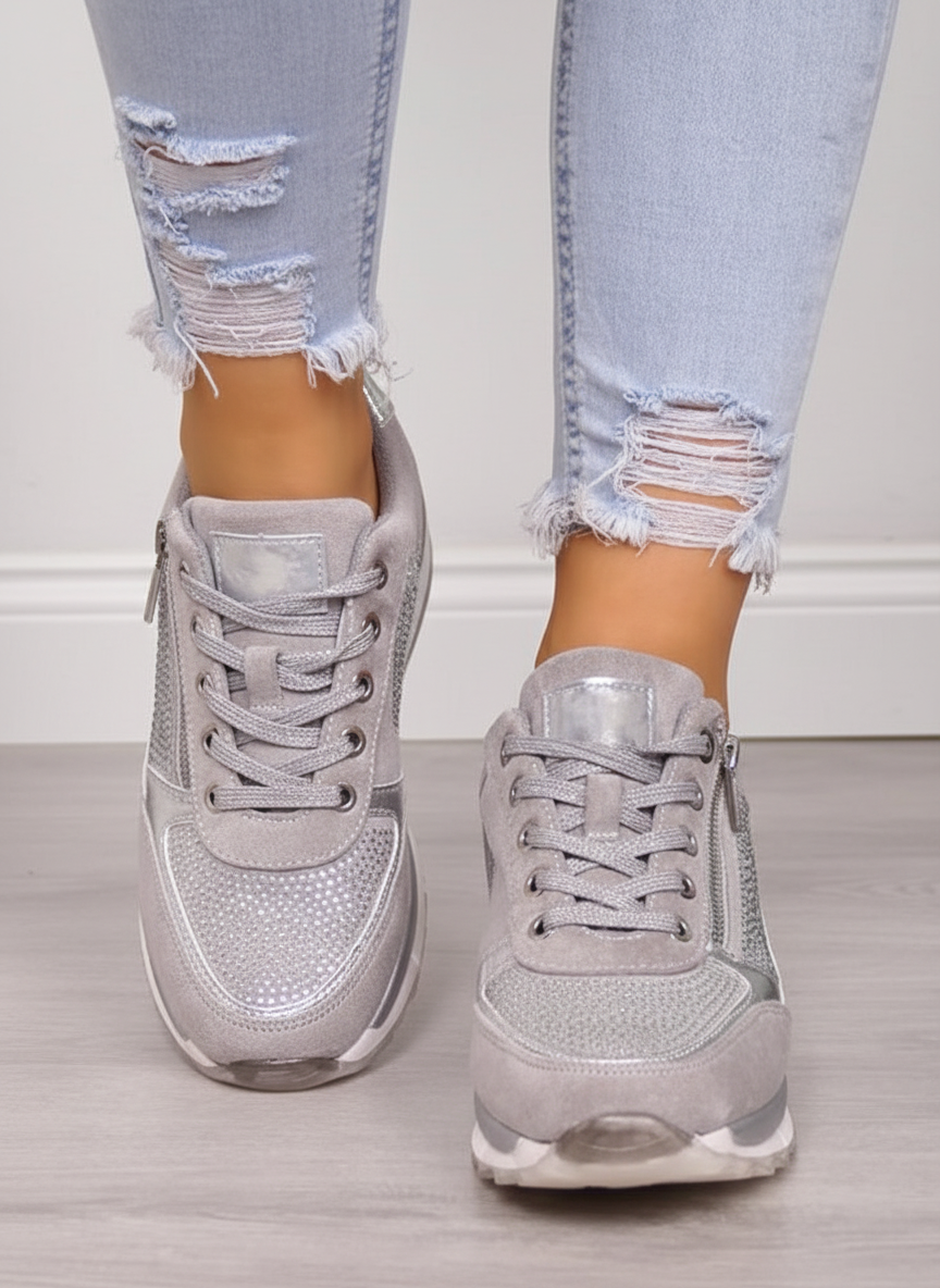 Women's low-top lace-up sneakers with metallic panel details and raised soles