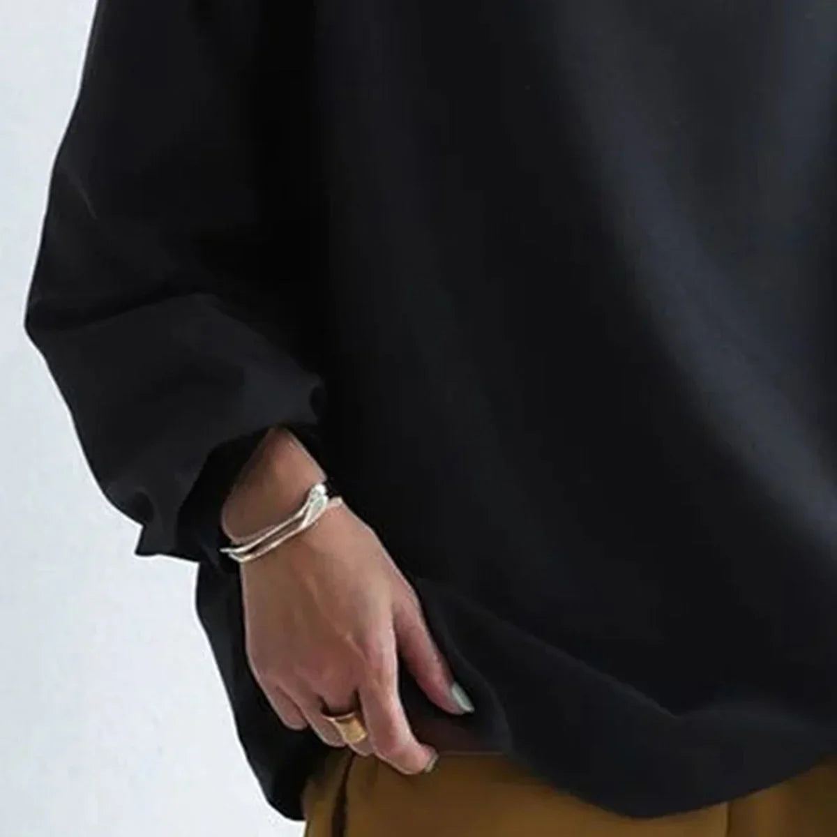 Women's black oversized jumper with mock neckline and long sleeves