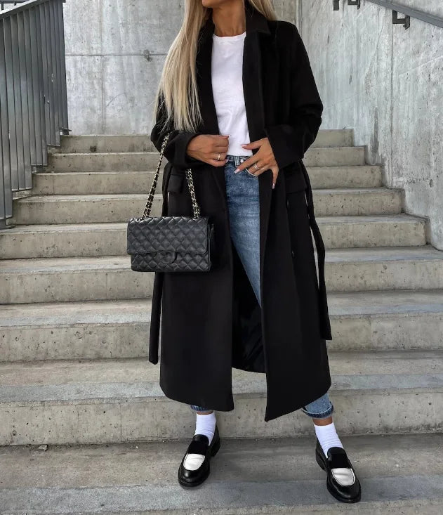 Women's longline belted double-breasted trench coat with lapel collar and long sleeves