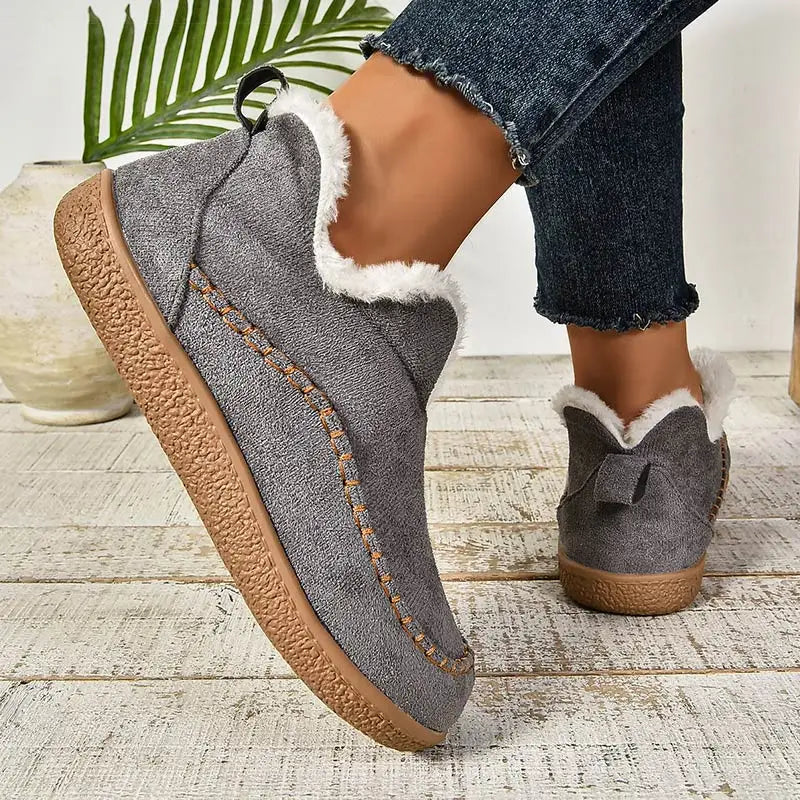 Women's fur-lined slip-on loafers with round toes and flat textured soles
