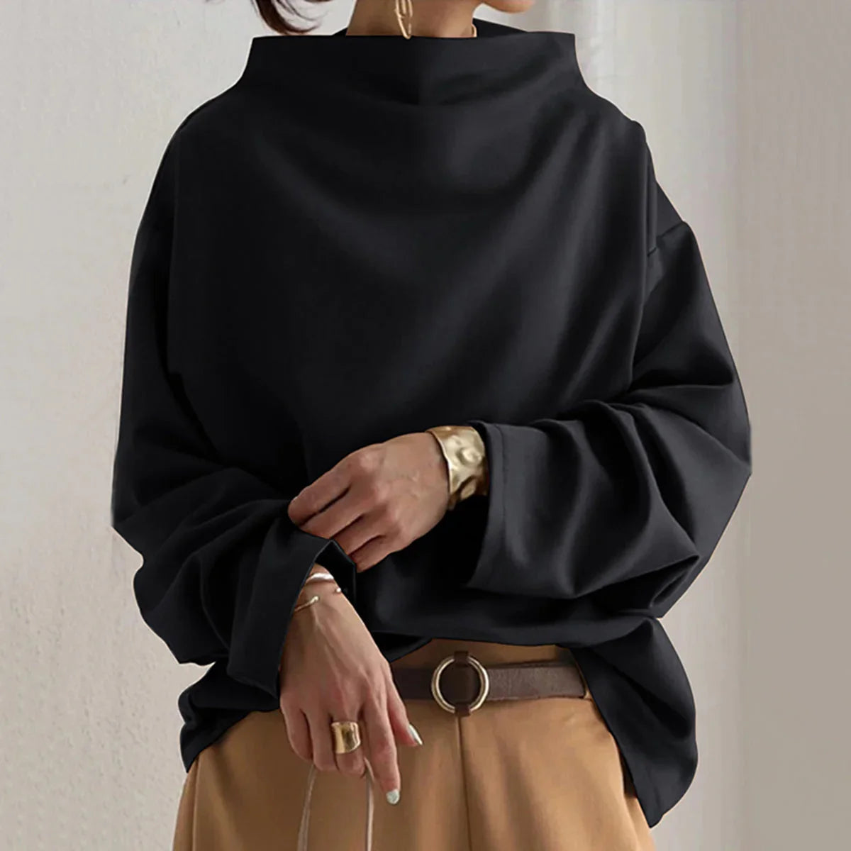 Women's black oversized jumper with mock neckline and long sleeves