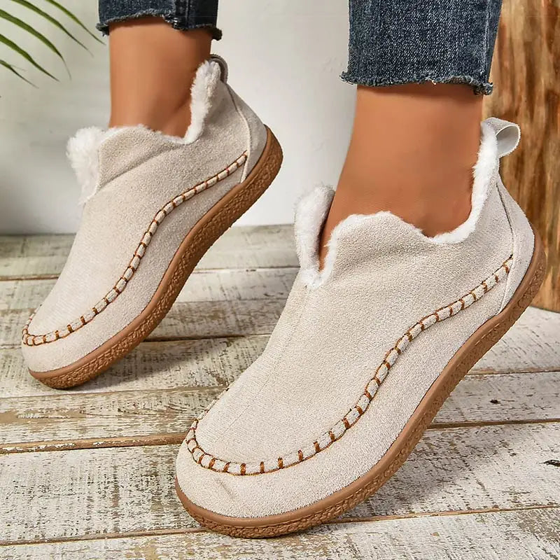 Women's fur-lined slip-on loafers with round toes and flat textured soles