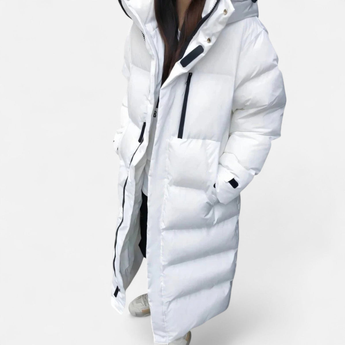 Women's long quilted hooded puffer coat shown in white and black