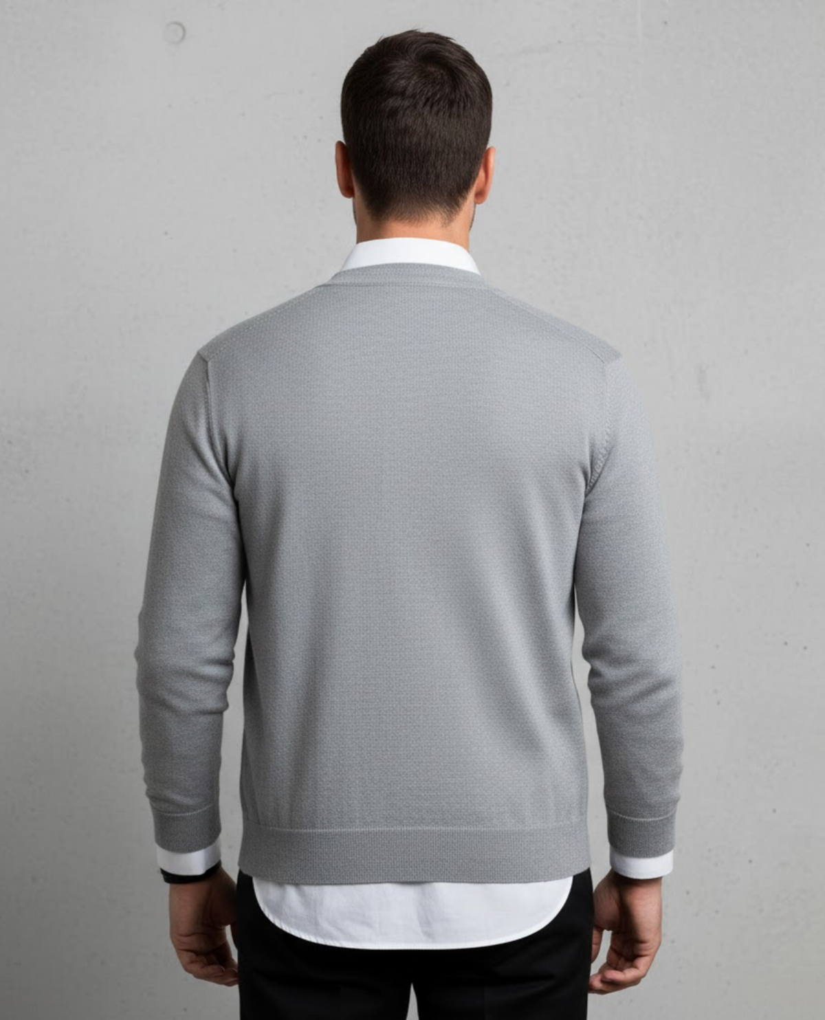 Men's long-sleeve V-neck button cardigan layered over a white shirt