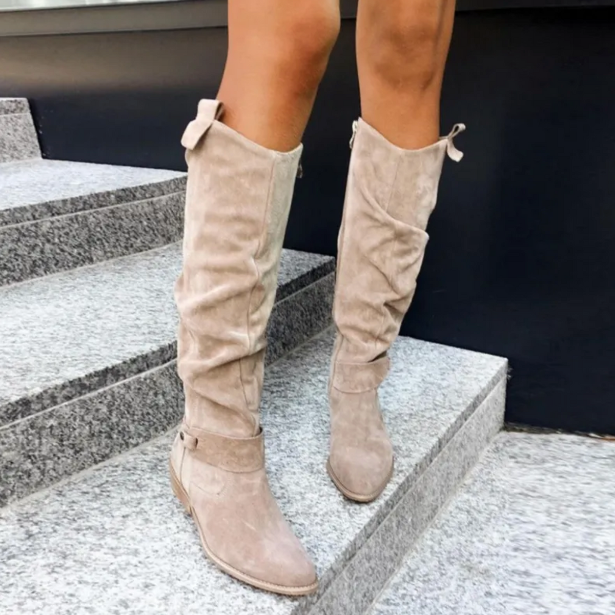 Women's slouch knee-high boots with pointed toes, flat heels and buckle details