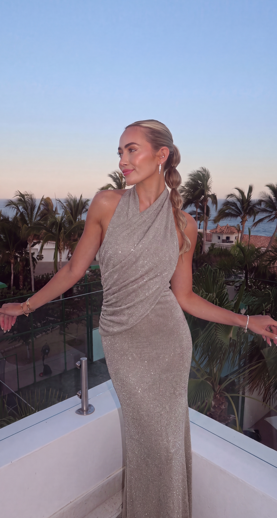 Women's silver halter wrap maxi dress with ruched waist and shimmering ribbed finish