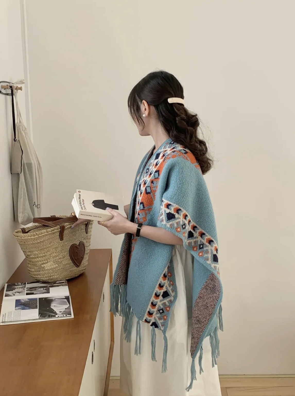 Women's geometric patterned cardigan with short sleeves and fringed edges