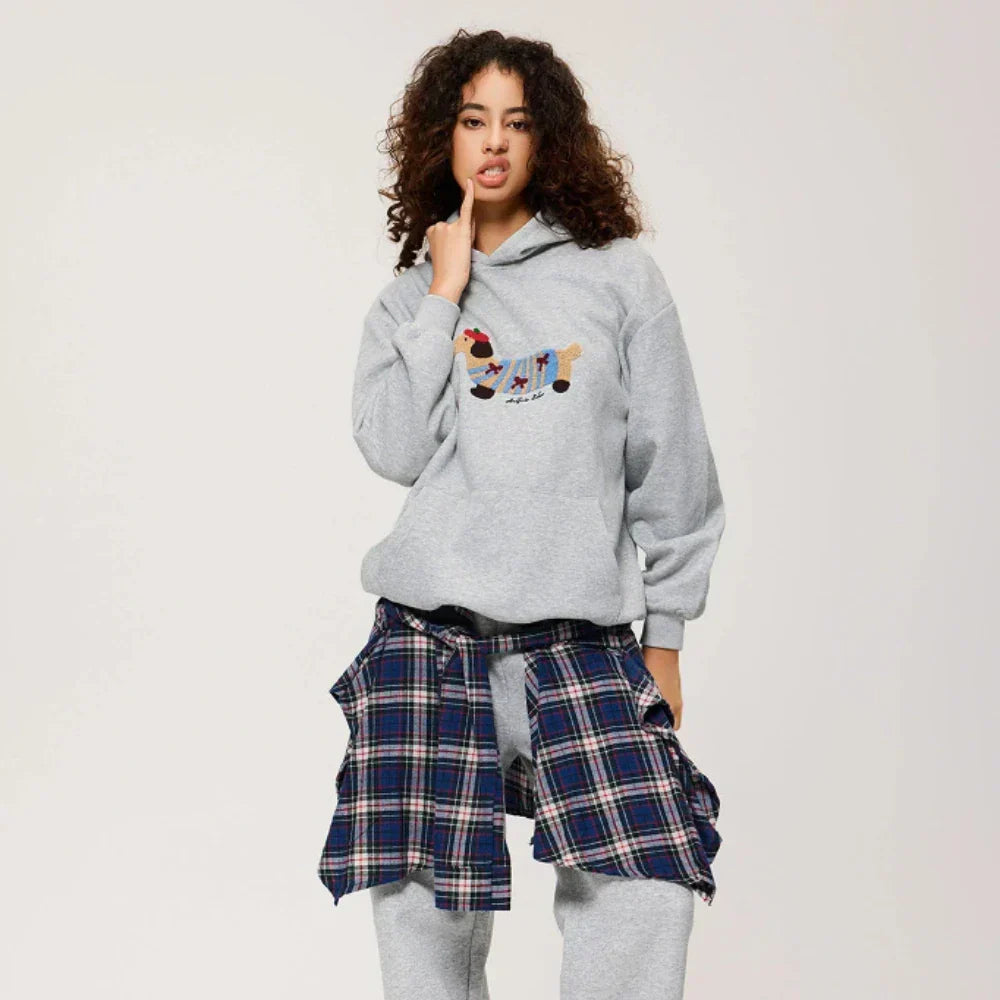 Women's hooded sweatshirt with embroidered dog graphic, long sleeves and kangaroo pocket