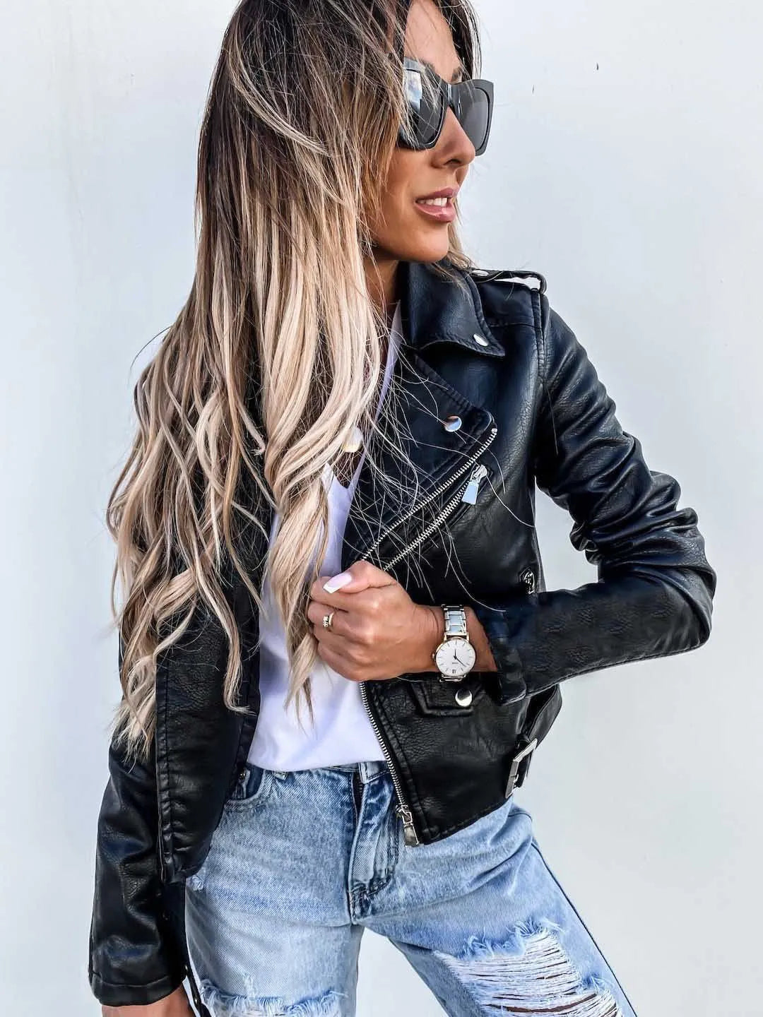 Women's cropped biker jacket with asymmetric zip, long sleeves and belted waist