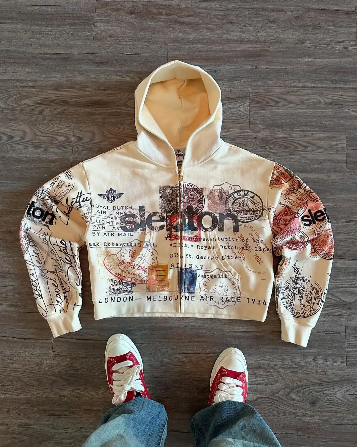 Beige graphic zip hoodie with hood and multicolour travel prints