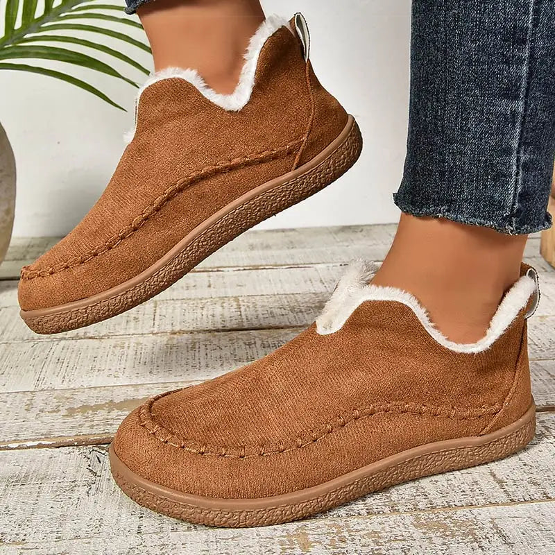 Women's fur-lined slip-on loafers with round toes and flat textured soles