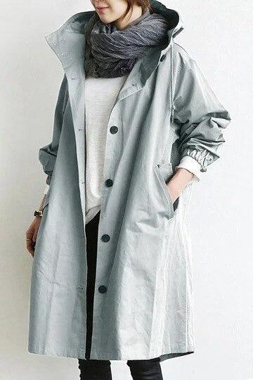 Women's long hooded trench coat with button front and side pockets