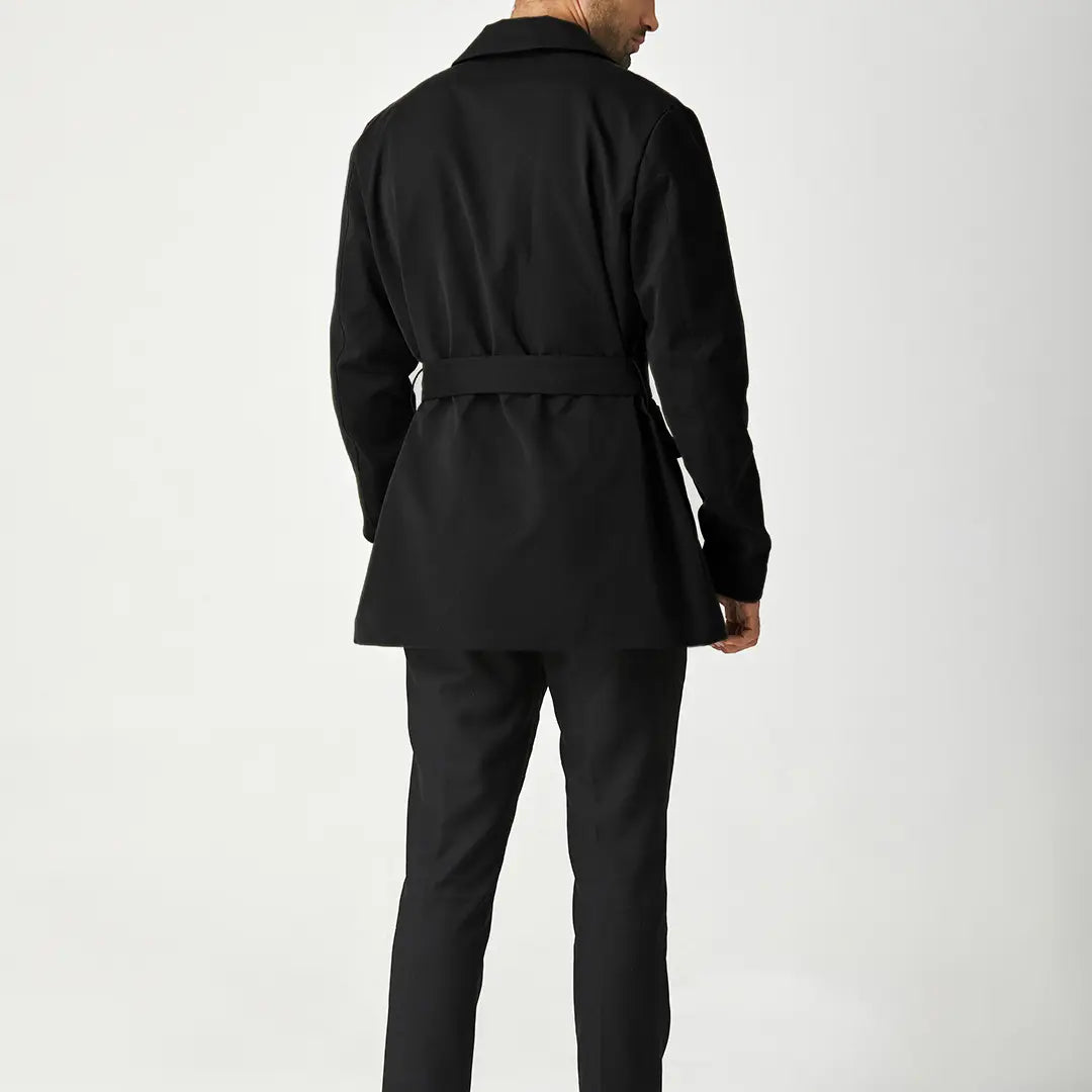 Black men's short trench coat with button front, long sleeves and rear storm flap