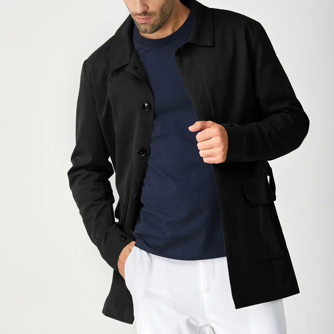 Black men's short trench coat with button front, long sleeves and rear storm flap