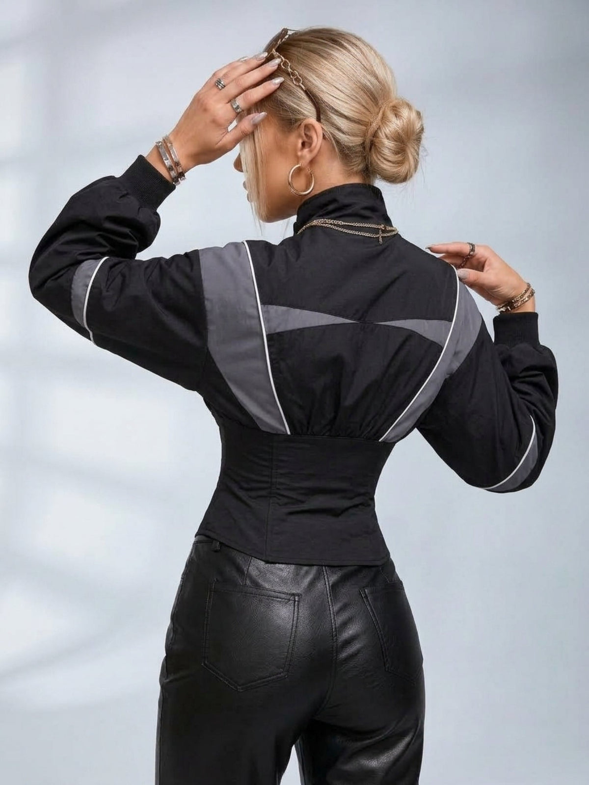 Women's grey and black colour block zip-up jacket with a cinched waist