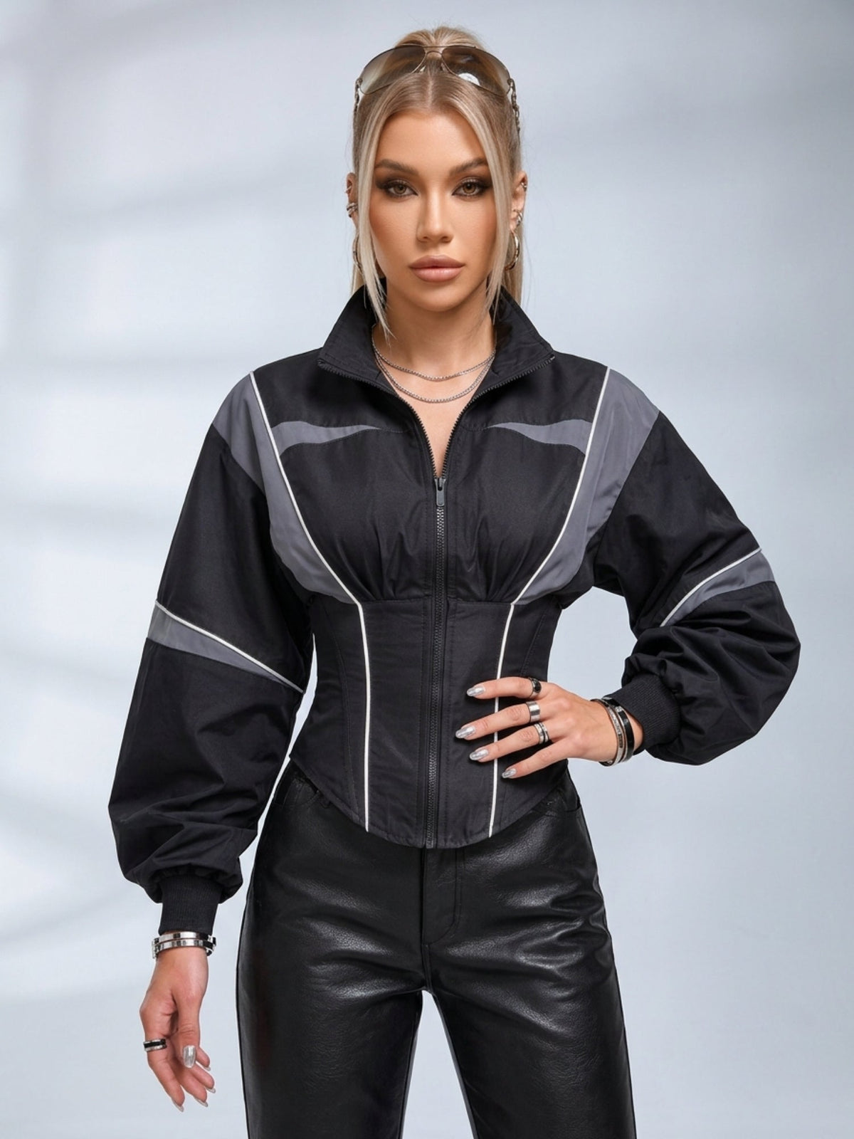 Women's grey and black colour block zip-up jacket with a cinched waist