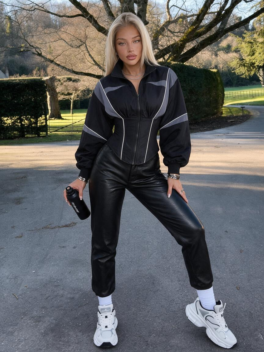 Women's grey and black colour block zip-up jacket with a cinched waist