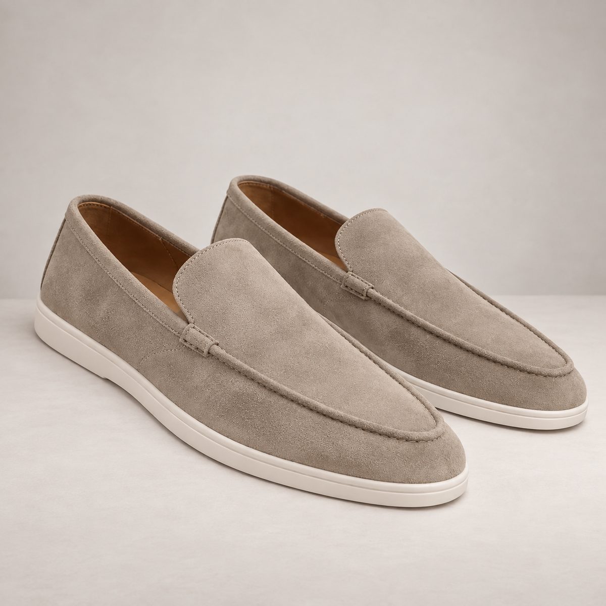 Men's slip-on moc toe loafers with stitched detail and flat light soles