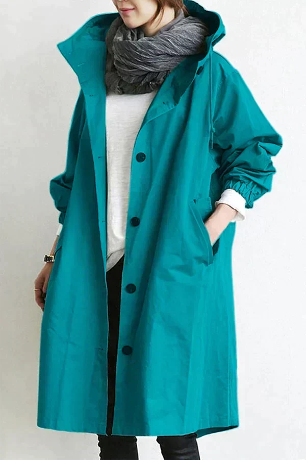 Women's longline hooded raincoat with button front and elasticated cuffs