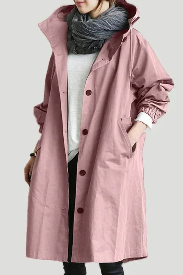 Women's longline hooded raincoat with button front and elasticated cuffs