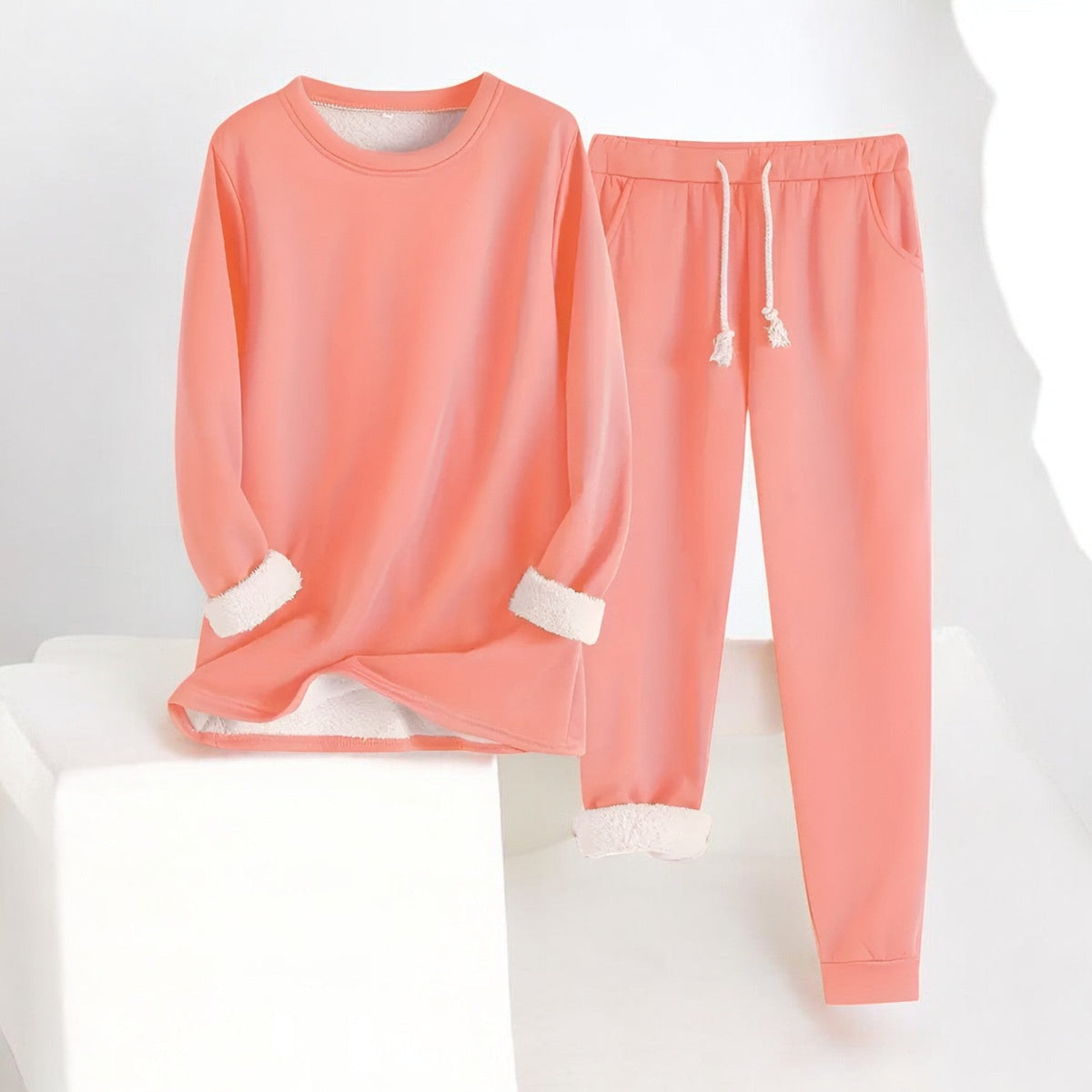Two-piece crew neck sweatshirt and jogger set with contrasting white cuffs and drawstring trousers